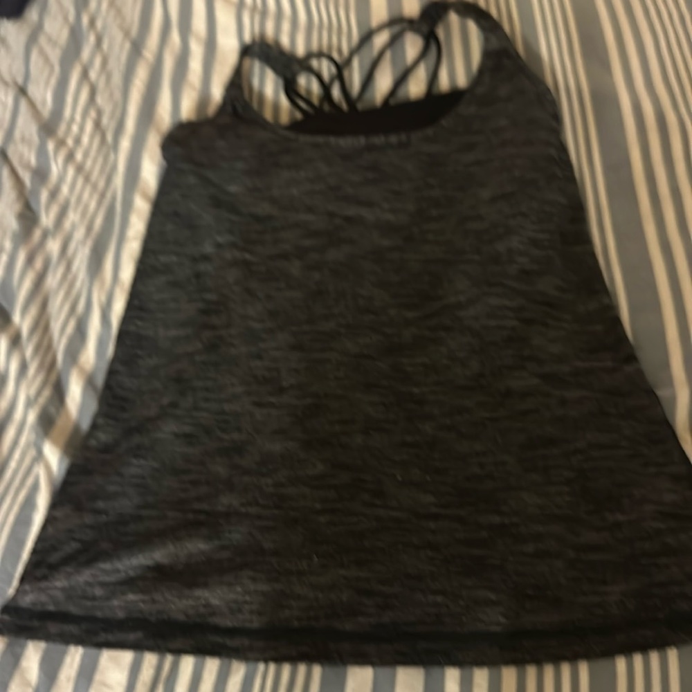 Lululemon running top built in bra with cute string back. Tag is removed / sm